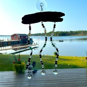Handcrafted sun catcher with driftwood. Made with genuine crystals & gemstones.